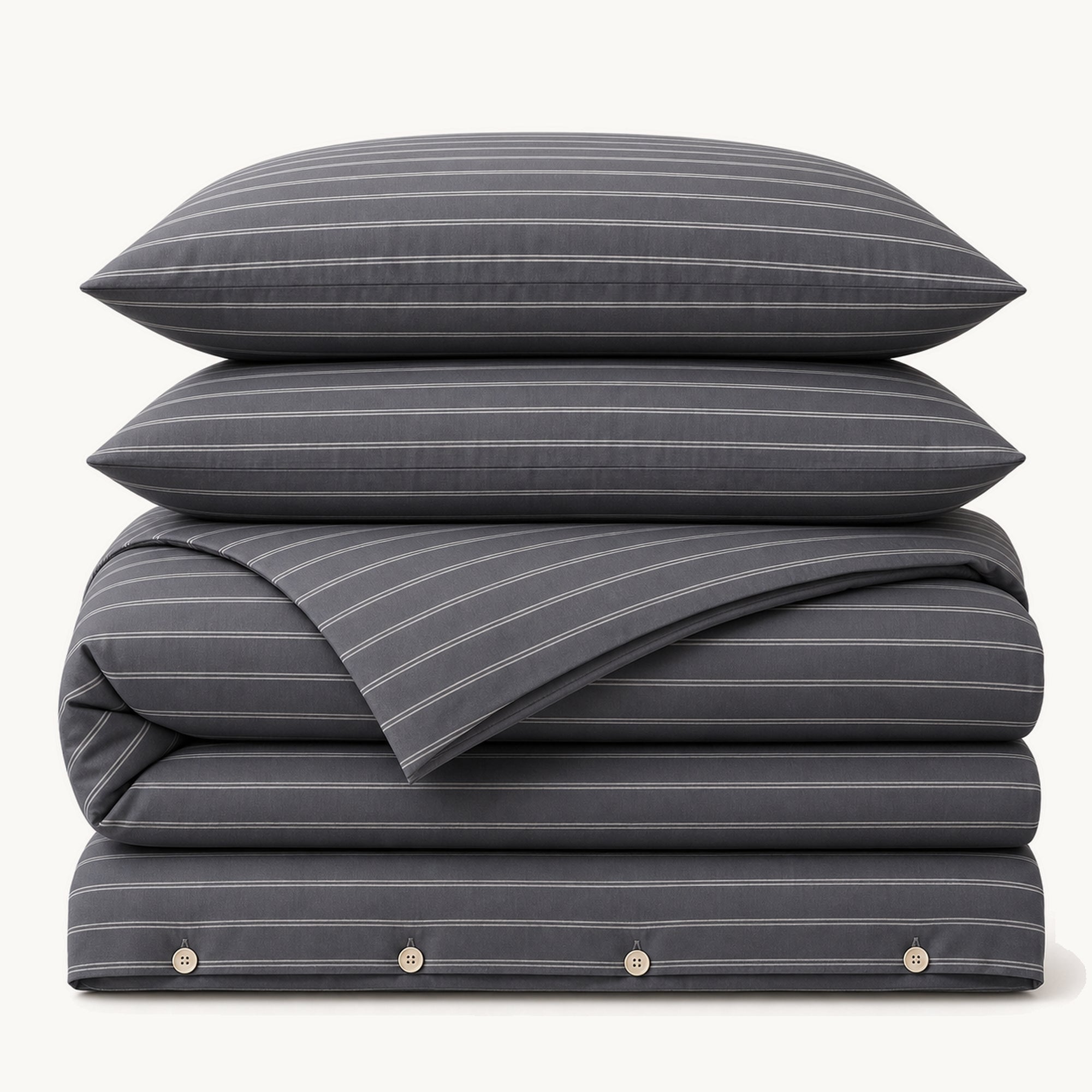 Stacked Black Stripe cotton sateen bedding set on a warm off-white background